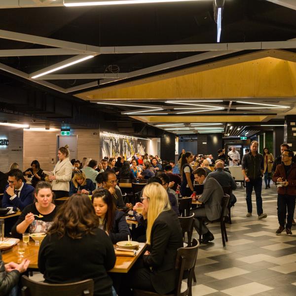 People eating lunch at tables in Allendale Square
