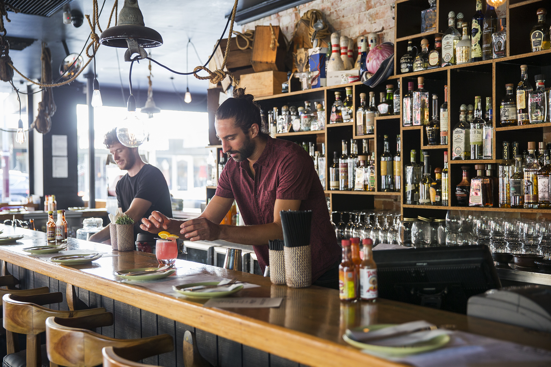 Barmen making drinks at La Cholita