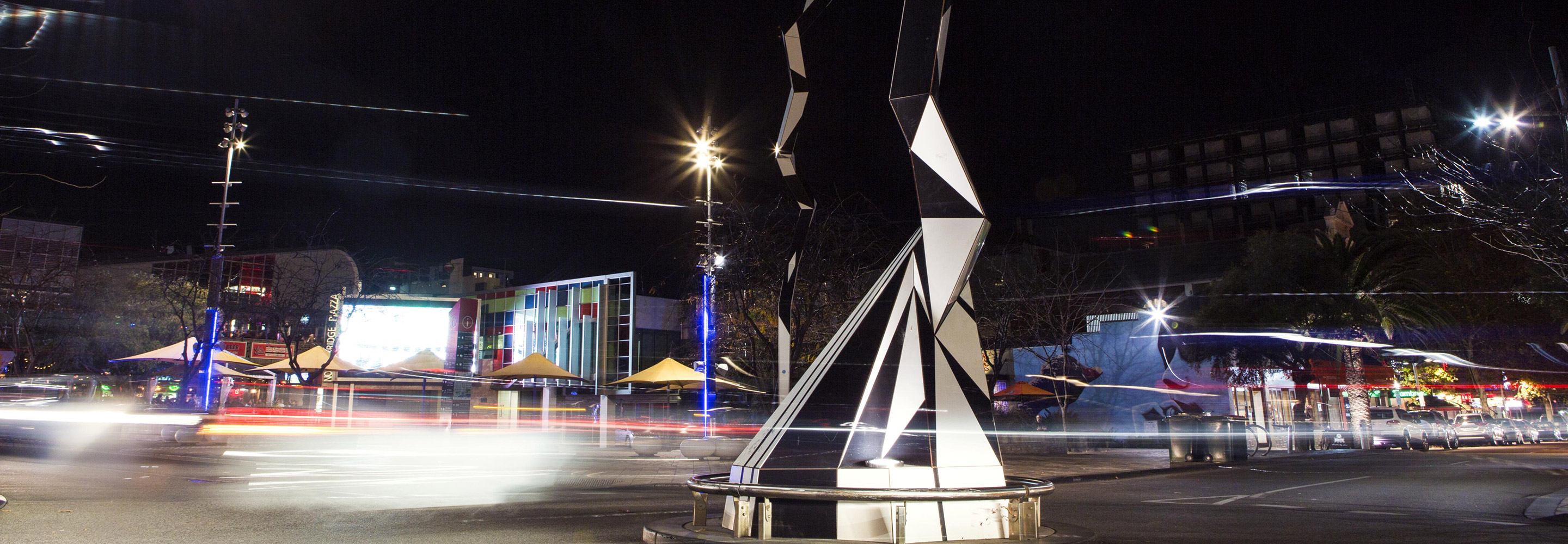 Modern sculpture in road in dark