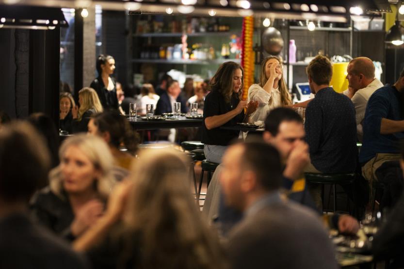 people having drinks at a bar